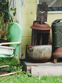 Abandoned potted plants in yard