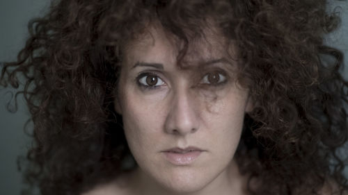 Close-up portrait of a serious young woman