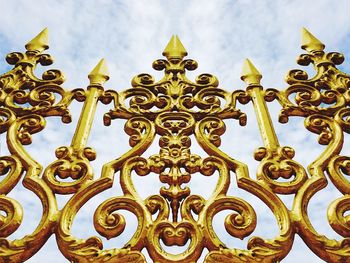 Low angle view of carvings against sky