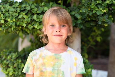 Portrait face of candid happy little kid boy of five years old with problem allergic skin