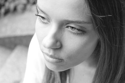 Close-up of young woman looking away