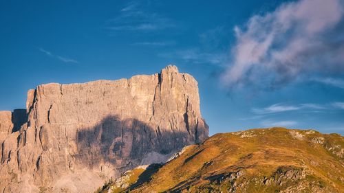 Low angle view of rock formations against sky