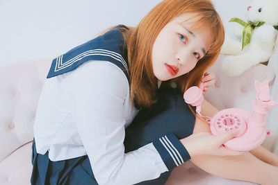 High angle view of girl holding flower
