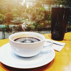 Close-up of coffee cup on table