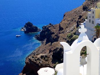 High angle view of bell tower at santorini against aegean sea