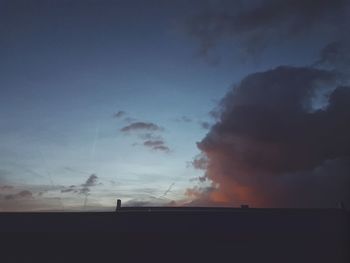 Silhouette landscape against sky during sunset