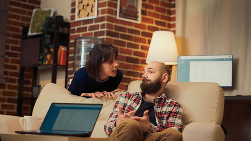 Young woman using laptop at office