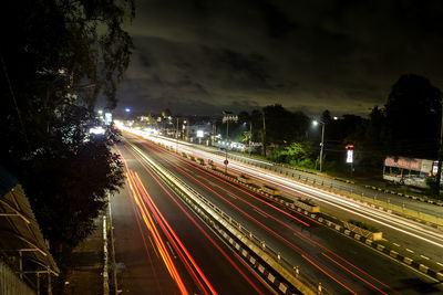 High angle view of light trails on road at night