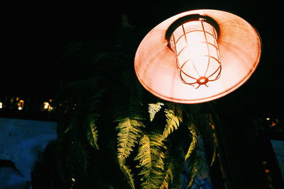 Close-up of illuminated lighting equipment at night