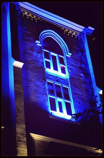 architecture, built structure, building exterior, blue, low angle view, night, window, illuminated, transfer print, auto post production filter, building, reflection, no people, outdoors, arch, city, wall - building feature, sunlight, lighting equipment