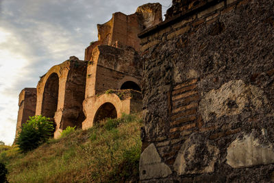 Low angle view of old ruin against sky