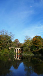 Scenic view of lake against blue sky