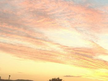 Low angle view of cloudy sky at sunset