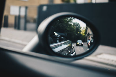 Reflection of car on side-view mirror