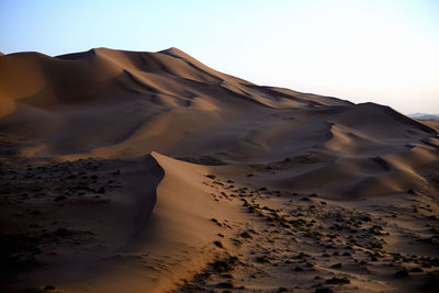 Scenic view of desert against clear sky