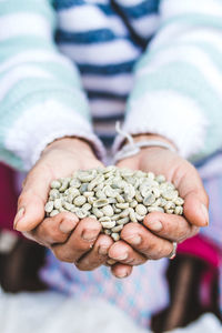 Midsection of woman holding lentils