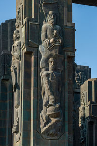 Low angle view of statue against building