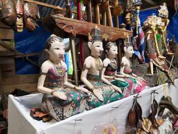 Statues at market stall