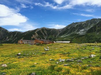 Scenic view of mountains against cloudy sky