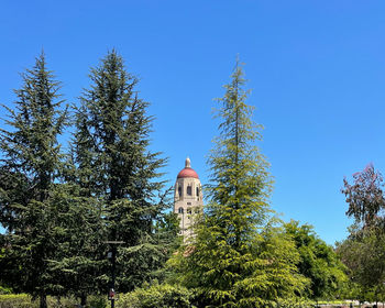 Low angle view of tower against clear blue sky