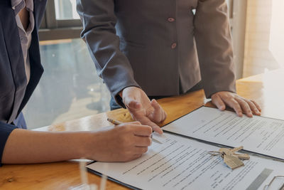 Low section of man and woman on table