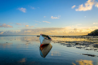 Boat in sea against sky