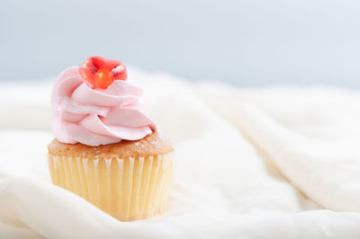 Close-up of cupcakes on cake