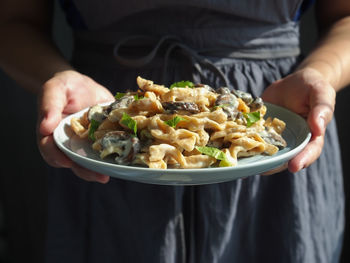 Midsection of man preparing food