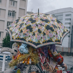 Low angle view of painting on building during rainy season