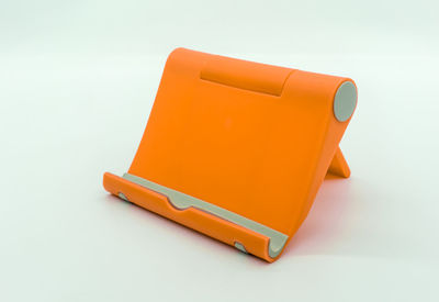 Close-up of yellow toy over white background