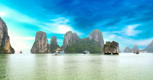 Panoramic view of bay against blue sky