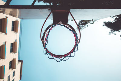 Low angle view of basketball hoop against sky