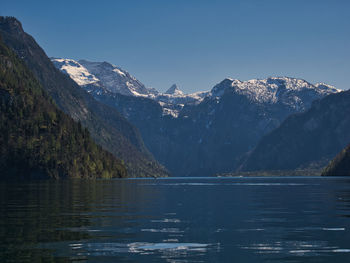 Scenic view of lake and mountains against sky