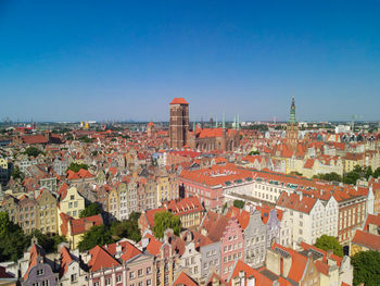 High angle view of townscape against blue sky