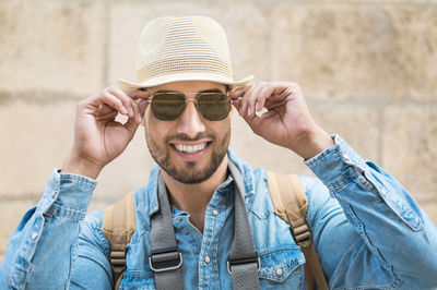 Portrait of young man wearing sunglasses