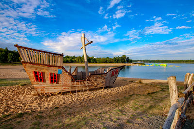 Scenic view of beach against blue sky