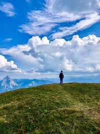 Man on field against sky