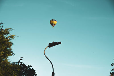 Low angle view of hot air balloons against sky