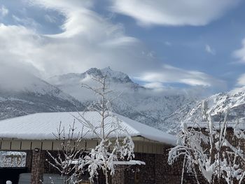 Scenic view of snowcapped mountains against sky