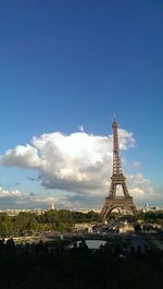 View of cityscape against blue sky