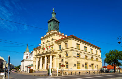 Low angle view of building against clear blue sky