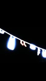 Close-up of illuminated lights at night