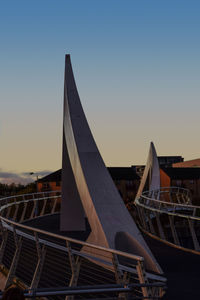 Built structure against clear sky at sunset