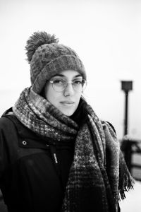 Woman standing against snow during winter