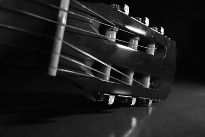 Close-up of guitar on table