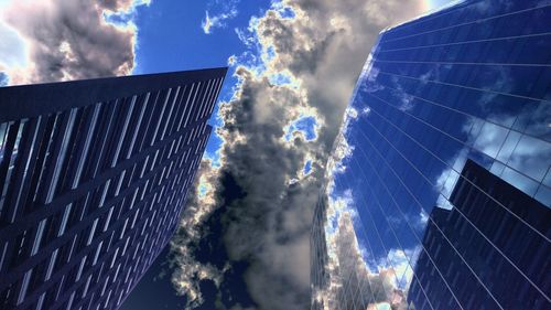 Low angle view of building against cloudy sky