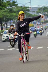 Man riding bicycle on road