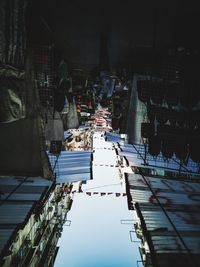 High angle view of people on street amidst buildings in city