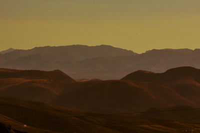 Scenic view of mountains against sky during sunset