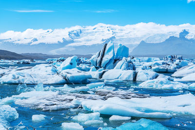 Scenic view of snowcapped mountains against sky